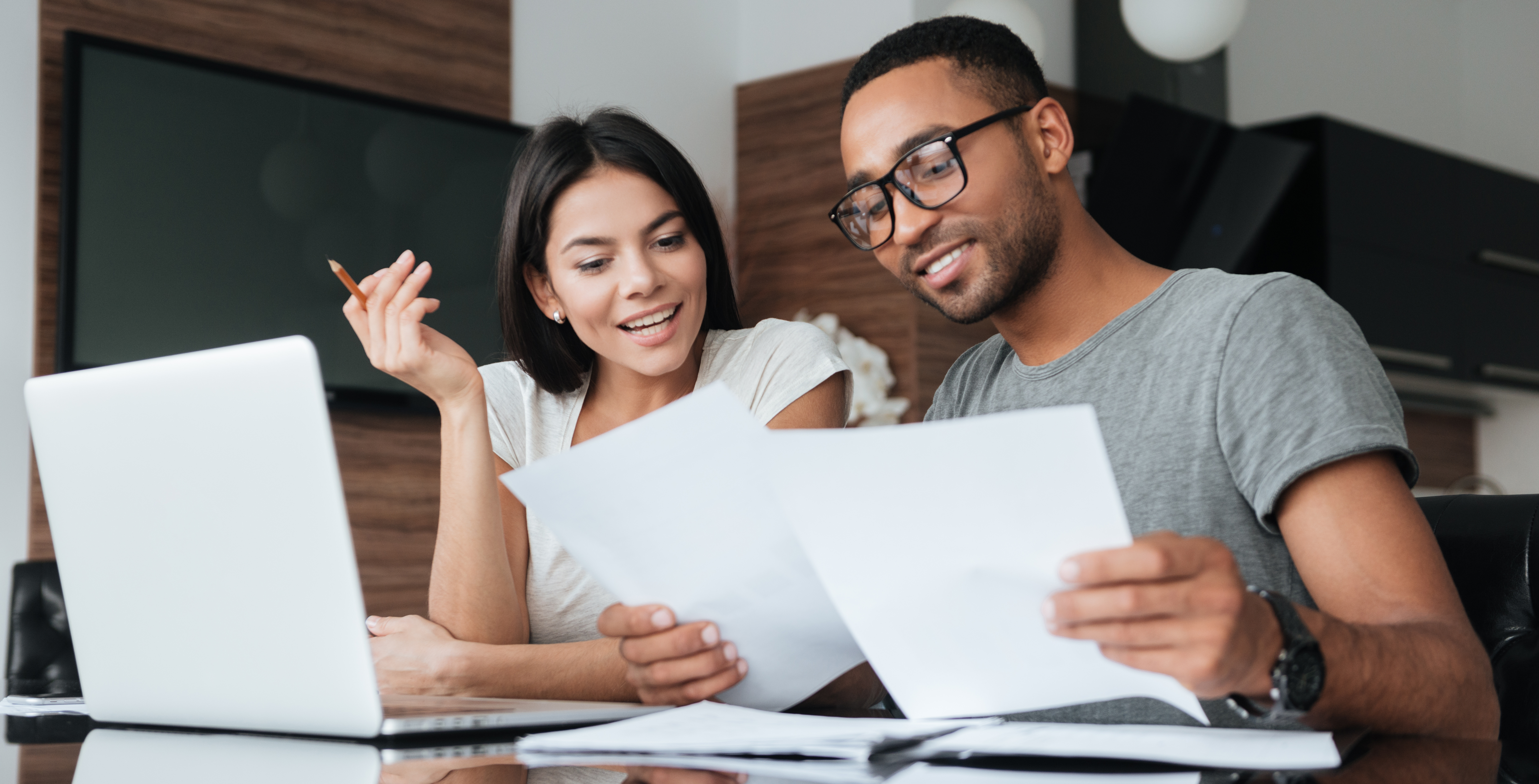 Couple looking at impact window financing